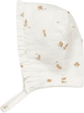 Touca creme com passarinhos estampados e folho à volta da cara